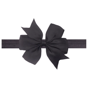 Detail of black grosgrain ribbon bow on elastic headband for babies and toddlers