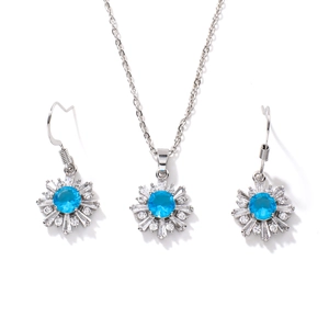 Elegant silver snowflake jewelry set with blue center stone and zircon necklace and earrings