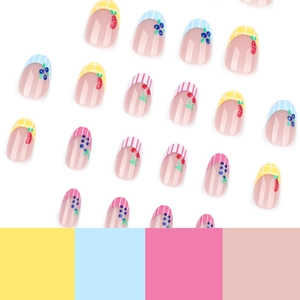 Cute fruit themed press-on nails with strawberry and cherry patterns on oval short tips