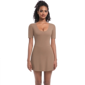 Detail of slim fit brown athletic dress with a crew neck and flared A-line hemline