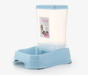 Detail view of gravity pet feeder with blue base and clear container for cats and dogs