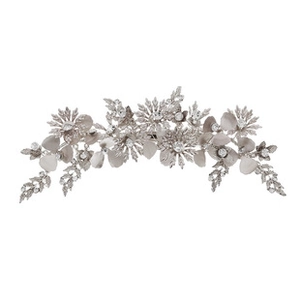 Detailed view of bridal hair clip with silver crystals and handmade pearl floral patterns