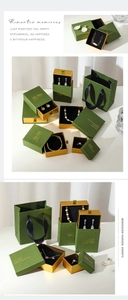 Detailed set of vintage green luxury jewelry gift boxes and paper bags for rings and necklaces
