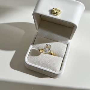 Detail of s925 silver ring with oval cut zircon gemstone in premium jewelry gift box
