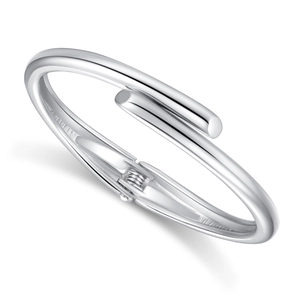 Minimalist silver-colored bypass bangle with spring hinge in polished metal finish