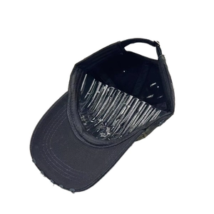 Detail view of black distressed cotton baseball cap interior with adjustable back strap