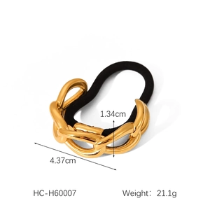 Detailed view of a gold metal chain hair tie with dimensions of 4.37cm by 1.34cm