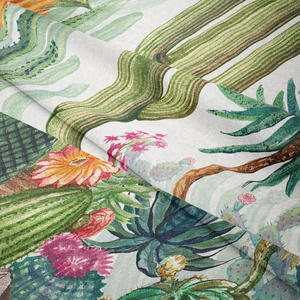 Close-up of cactus and desert flower print on textured woven polyester tapestry fabric