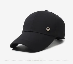 Detail of black baseball cap with premium textured fabric and silver SPORT metal emblem
