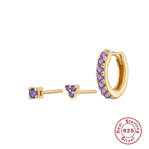 Macro detail of 925 sterling silver trinity earring set with purple round-cut stones