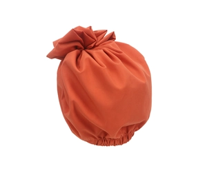 Detail of orange hair bonnet featuring elastic band and textured floral pleated fabric