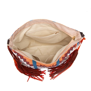 Interior view of bohemian woven tote showing lining with zipper and slide pockets