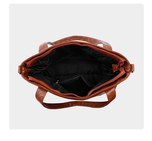 Top view of spacious caramel brown tote bag interior with multiple compartments