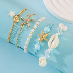 Set di 5 bracciali da spiaggia con stelle marine dorate, conchiglie e perline boho
