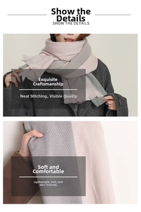 Detail of pink and grey cashmere scarf showing fringe and diagonal twill weave texture