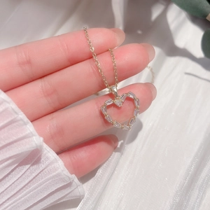 Titanium steel heart pendant necklace with gold plating and cubic zirconia inlay