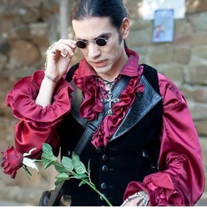 Gothic style vampire outfit with burgundy satin shirt, black vest and small round sunglasses