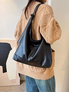 Large capacity black leather shoulder bag with adjustable strap for commuting style