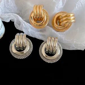 Boucles d'oreilles circulaires évidées torsadées en or et argent pour femmes