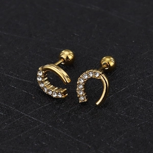 Macro detail of U-shaped gold earrings with paved zircons and screw ball backings