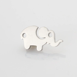 Macro view of mirror polished stainless steel mini elephant pendant charm for DIY jewelry