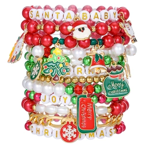 Detail of Christmas beaded bracelet set with Santa and Snowman charms in festive colors