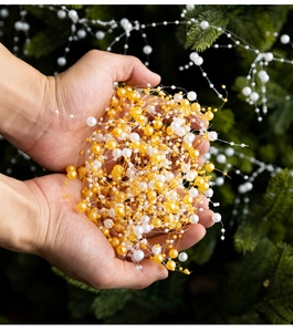 Close-up of white and gold crystal pearl beads chain for Christmas tree decoration DIY