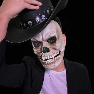 Realistic Halloween skull mask and black cowboy hat with skull band detail