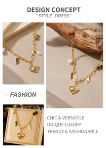 Detail of gold chain necklace with colorful heart, lightning, and pearl charms