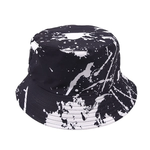 Ink splash print bucket hat with black and white graffiti design for outdoor sun protection
