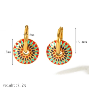Detail of vintage 18k gold hoop earrings with colorful enamel geometric patterns