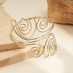 Silver twisted spiral upper arm cuff bracelet with minimalist bohemian geometric design