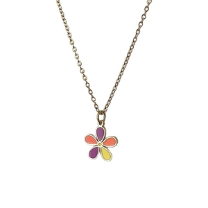 Colorful floral drip oil pendant necklace with purple and orange petals on a gold chain