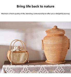 Detail of handmade woven picnic basket with liner and large rustic wicker jar with lid