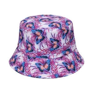 Reversible bucket hat with blue butterfly and purple grass floral print pattern