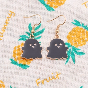 Detailed view of Halloween ghost earrings featuring black enamel and gold alloy finish