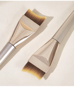 Detail of soft synthetic fiber bristles on the crescent-shaped foundation makeup brush