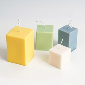Minimalist square pillar candles in pastel colors with creative geometric cube design