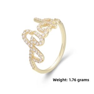 Macro detail of 1.76g gold S925 silver ring featuring pave-set zircon Love script