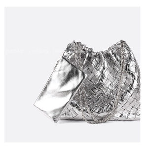 Silver woven bucket bag and clutch set with sleek metal chain strap and reflective texture