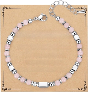 Close-up of handmade 4mm pink zebra stone beaded bracelet on a kraft paper gift card