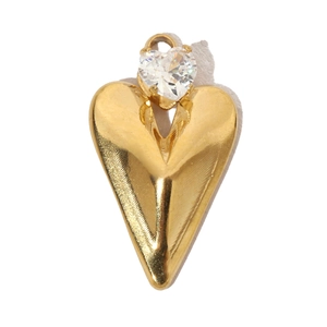 Macro detail of gold-plated heart pendant with sparkling clear zircon stone on white background