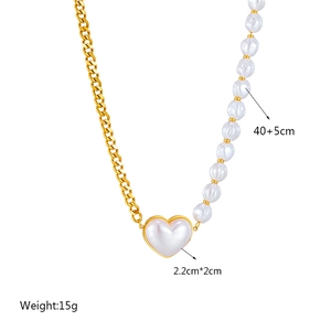 Asymmetric gold chain necklace with baroque pearls and a white heart pendant 40+5cm