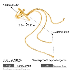 Detail of gold cross ear cuff with tassel chains and dimensions in stainless steel