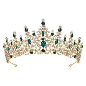 Detail of gold crystal crown featuring emerald gems and clear rhinestones for girls