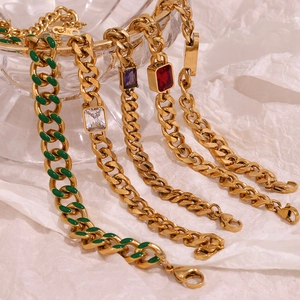 Detail of 18K gold plated Cuban chain bracelets with colorful zircon and enamel charms