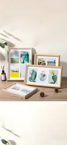Detail of Nordic hollow wooden photo frames with natural finish in multi-panel display