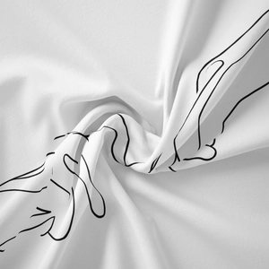 Detailed view of white tapestry fabric featuring minimalist black line art hand drawings