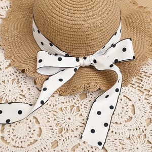 Straw sun hat with wave brim and black polka dot bow ribbon for women and kids