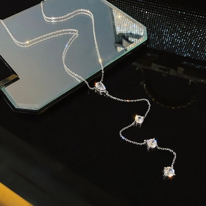 Elegant silver tassel body chain with zircon pendants and water drop stone on black mirror